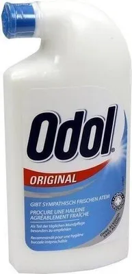 A white plastic bottle of Odol Original mouthwash with a blue cap.
