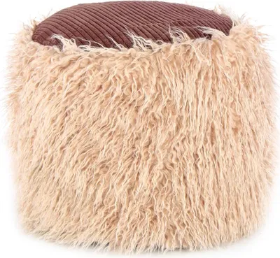 A close-up view of a round ottoman with a textured brown top and shaggy beige sides.