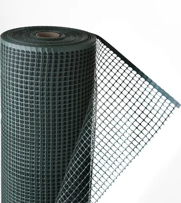 A roll of dark green plastic mesh fencing.