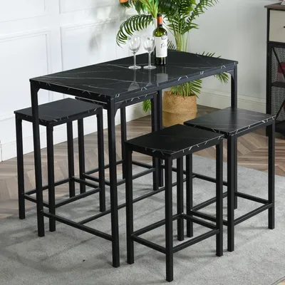 A black marble-patterned dining set with four stools is shown in a room.
