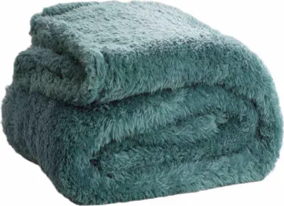 A folded teal-colored fuzzy blanket is shown against a white background.