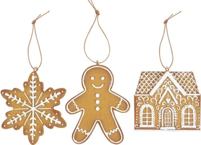 Three gingerbread-themed Christmas ornaments hanging against a white background.