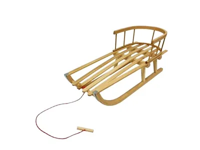 A wooden sled with a red rope and handle, isolated on a white background.