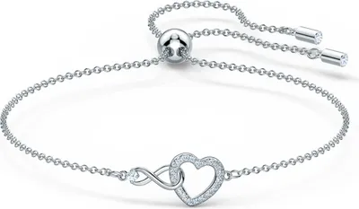 A close-up studio shot of a silver bracelet with a heart and infinity symbol charm.