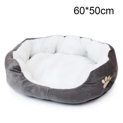 A soft, round pet bed with raised sides, made of gray and white plush material, with a paw print logo on the side.