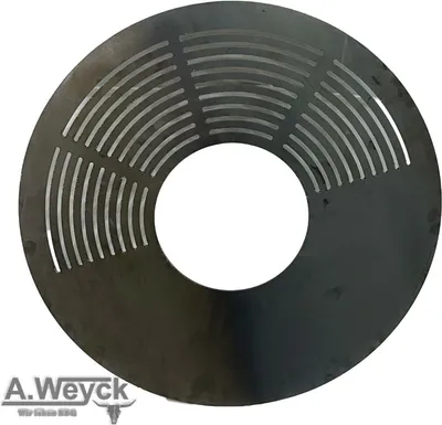 A circular metal grill grate with cutouts, placed on a white background.