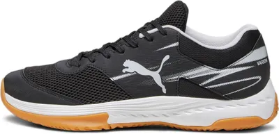 A side view of a black Puma sneaker with white accents and a brown sole.
