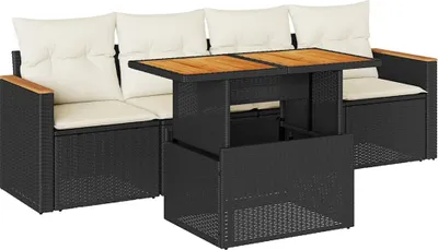 A black rattan sofa set with cream cushions and a wooden-topped coffee table.
