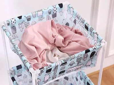 A close-up view of a laundry basket filled with clothes.