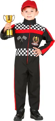 A young boy dressed in a racing suit holds a trophy.