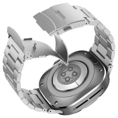 The back of a smartwatch with a metal band is shown, with the clasp of the band open.