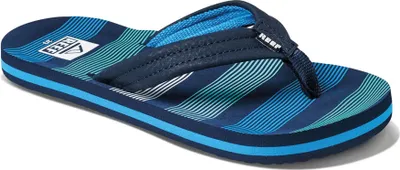 Produktbild von Reef Ahi Kinder Slipper mit gepolsterten Kunstlederriemen, vorgeformtem EVA-Fußbett und strapazierfähiger EVA-Sohle