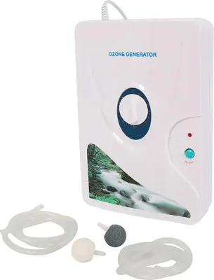 A white ozone generator with accessories laid out in front of it.