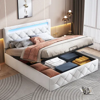 A bedroom scene featuring a white upholstered bed with LED lighting and storage compartments.