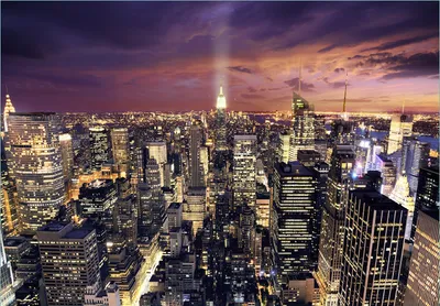 Produktbild von Wallario Fototapete Vliestapete, seidenmatte Oberfläche, einfache Verarbeitung, Größe 300 x 210 cm, Motiv New York bei Nacht - Panoramablick über die Stadt
