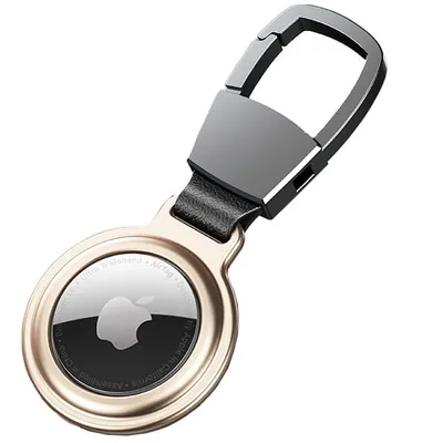 A close-up studio shot of a golden Apple AirTag case with a carabiner clip.