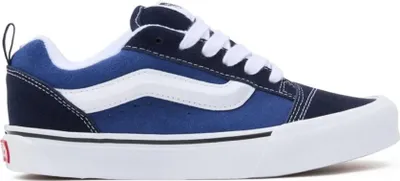 A side view of a blue and white Vans Knu Skool sneaker.