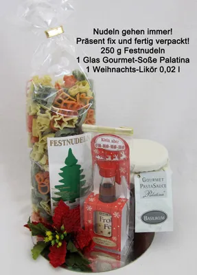 A Christmas-themed gift set containing pasta, gourmet sauce, and liqueur.