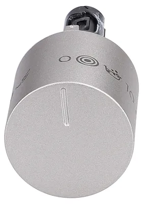 Close-up studio shot of a silver oven control knob.