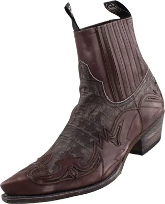 Auf dem Bild ist ein grauer Schuh zu sehen der eine moderne und sportliche Form hat. Die Ansicht zeigt den Schuh von der Seite und hebt die Details des Designs hervor.