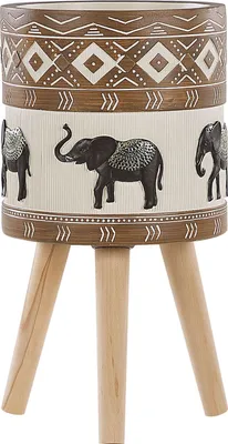 A planter pot with an elephant motif and wooden legs, shown against a white background.