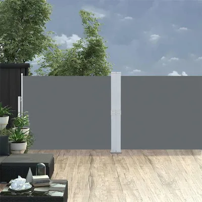 An outdoor patio scene with a grey retractable side awning.