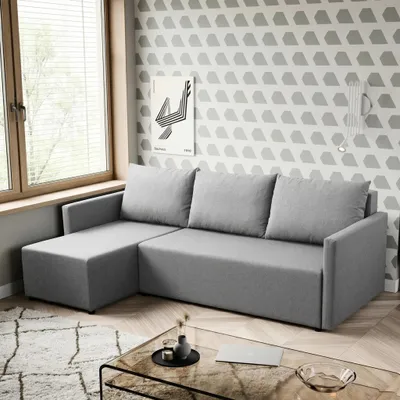 Productafbeelding van De Ecksofa Solid, bekleed met de stof FARO, combineert stijl en comfort. Met een slaapfunctie, een opbergruimte en een keuze uit verschillende opstellingen – praktisch en elegant voor elk huis. (Kleur: grijs 22)