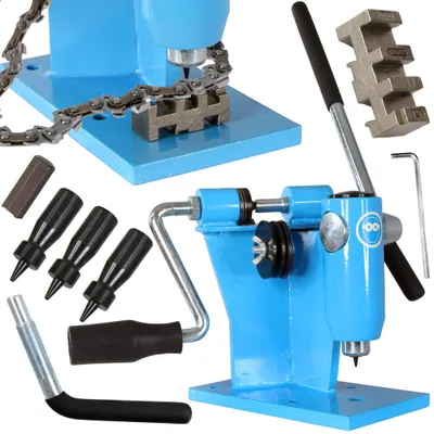 A collection of tools for working with chains, including a chain press and various accessories, arranged on a white background.