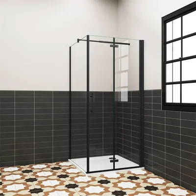 A modern bathroom with a black-framed glass shower enclosure.