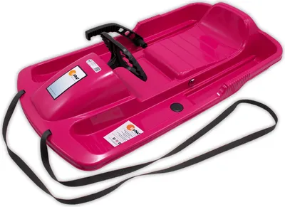 A pink plastic sled with a steering wheel and black straps, shown from a slightly elevated angle against a white background.