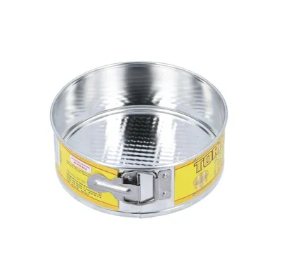 A round springform cake pan with a textured bottom and a yellow label around the rim.
