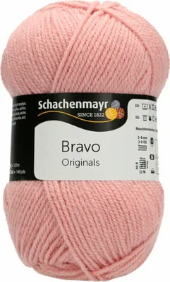 A ball of pink yarn with a label.