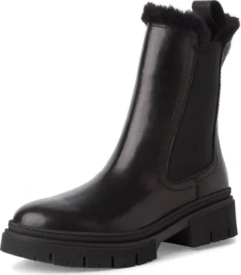 A studio shot of a single black boot.