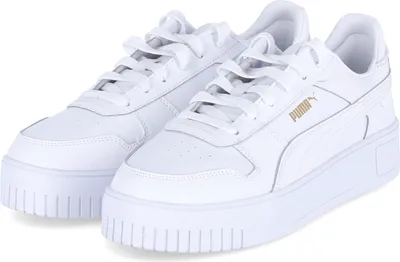 A pair of white Puma sneakers with gold branding.