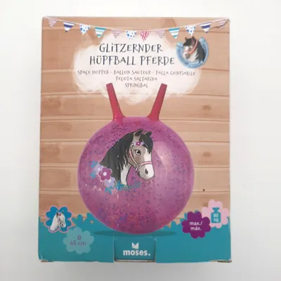 The image shows the packaging of a glittery horse-themed hopper ball. The packaging features a wooden plank background and a drawing of the hopper ball with a horse illustration on it.