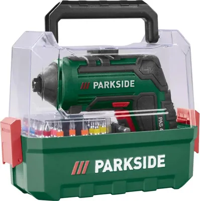 A green and black Parkside cordless screwdriver with accessories in a clear plastic case.