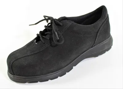 A black suede shoe is shown against a white background.