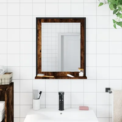 A bathroom mirror with a wooden frame and shelf above a sink.