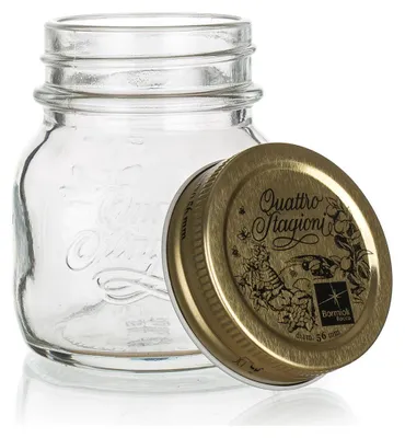 A clear glass jar with a gold lid, shown on a white background.