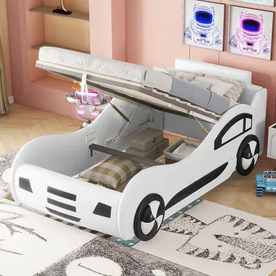 A white car-shaped bed with the mattress lifted to reveal storage space underneath, in a child's bedroom.