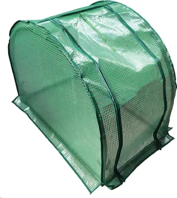 A green mini greenhouse with a transparent cover.