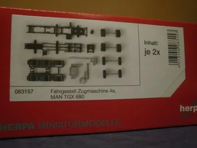 Produktbild von Herpa 083157 - 1/87 Fahrgestell MAN TGX 680 Schwerlast 4-achs (2 Stück) - Neu