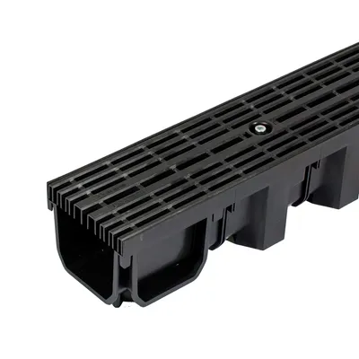 A close-up, studio shot of a black drainage channel with a grate.