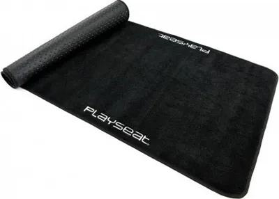 A black Playseat floor mat is shown rolled up on one end and unrolled on the other.
