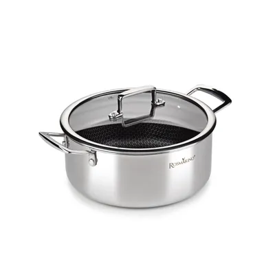 A stainless steel pot with a glass lid and honeycomb pattern inside.