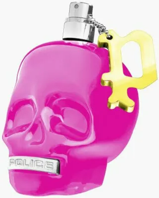 A pink skull-shaped perfume bottle with a gold key charm.