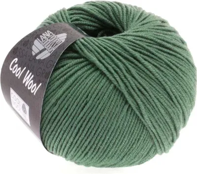 A ball of green yarn with a label wrapped around it.