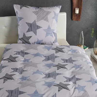 A close-up view of a star-patterned duvet cover and pillowcase.