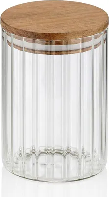 A clear studio shot of a glass jar with a wooden lid.
