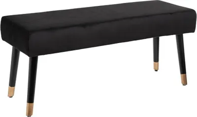 A black velvet bench with gold-tipped legs on a white background.